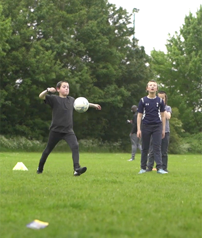 three boys playing with ball